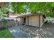 Charming one-story home with a well-maintained lawn, gated entrance and mature trees at 5083 Village Dr, Las Vegas, NV 89142