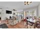 Spacious living room features wood floors, a ceiling fan, and plenty of natural light at 5083 Village Dr, Las Vegas, NV 89142