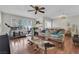 View of the living room featuring hardwood floors, windows and neutral walls at 5083 Village Dr, Las Vegas, NV 89142