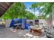 Backyard patio features ample entertaining space, outdoor grill, and lounge seating at 5083 Village Dr, Las Vegas, NV 89142