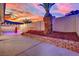 A beautifully landscaped backyard with a palm tree, pool and covered patio at 5509 Rose Thicket St, Las Vegas, NV 89130