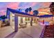 A backyard view shows a patio, pool, and lush landscaping at 5509 Rose Thicket St, Las Vegas, NV 89130