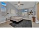 Bedroom with carpet and tile flooring and a ceiling fan at 5509 Rose Thicket St, Las Vegas, NV 89130