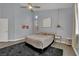 Bedroom with carpet and tile flooring and a ceiling fan at 5509 Rose Thicket St, Las Vegas, NV 89130