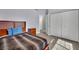 Comfortable bedroom featuring wood-look floors, a modern bed, and ample closet space at 5509 Rose Thicket St, Las Vegas, NV 89130
