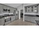 Kitchen with gray cabinets, stainless steel appliances, and tile floors at 5509 Rose Thicket St, Las Vegas, NV 89130