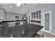 Well-lit kitchen with pantry and a kitchen island at 5509 Rose Thicket St, Las Vegas, NV 89130