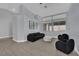The bright living room offers tile flooring and neutral paint at 5509 Rose Thicket St, Las Vegas, NV 89130