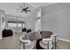 Open-concept living room with high ceilings, large windows, and contemporary furnishings at 5509 Rose Thicket St, Las Vegas, NV 89130