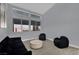 Bright living room featuring large windows and modern decor at 5509 Rose Thicket St, Las Vegas, NV 89130