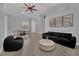 Spacious living area with wood flooring and contemporary furnishings at 5509 Rose Thicket St, Las Vegas, NV 89130