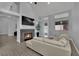 Inviting living room with fireplace and lots of natural light at 5509 Rose Thicket St, Las Vegas, NV 89130