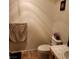 Bathroom featuring a tiled counter and a toilet at 561 E Bourbon St, Pahrump, NV 89048