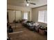 Bedroom featuring a large closet with sliding mirrored doors and a window at 561 E Bourbon St, Pahrump, NV 89048