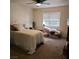 Cozy bedroom with plush bedding and a window offering natural light at 561 E Bourbon St, Pahrump, NV 89048