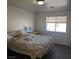 Relaxing bedroom featuring a bed, carpet, and a window at 561 E Bourbon St, Pahrump, NV 89048