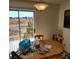 Inviting dining area featuring a window with a view and a round wooden table at 561 E Bourbon St, Pahrump, NV 89048