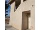 Exterior of a home with a stucco finish and a covered entryway at 561 E Bourbon St, Pahrump, NV 89048