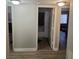 Bright hallway with natural light leading to the bathroom and bedroom in this inviting home at 561 E Bourbon St, Pahrump, NV 89048