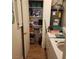 Laundry room featuring a washer, dryer, shelving, and storage space at 561 E Bourbon St, Pahrump, NV 89048