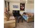 Cozy living room featuring two sofas, a coffee table, and decorated with artwork and tapestries at 561 E Bourbon St, Pahrump, NV 89048