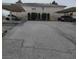 Exterior shot of the property's parking area, featuring carports and asphalt pavement at 561 E Bourbon St, Pahrump, NV 89048