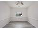 Bedroom featuring neutral walls, modern wood-look flooring, and a ceiling fan at 5761 E Badlands Ln, Pahrump, NV 89061