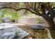 Backyard featuring a concrete patio, shade trees, and trampoline at 5907 Zawawi Ct, Las Vegas, NV 89110
