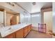 Bright bathroom featuring a double sink vanity and a separate tub at 5907 Zawawi Ct, Las Vegas, NV 89110