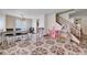 Spacious living area featuring tile flooring, large windows, and ample room for seating and decor at 5907 Zawawi Ct, Las Vegas, NV 89110