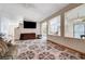 Comfortable living room features uniquely patterned tile flooring and a pass-through to the kitchen at 5907 Zawawi Ct, Las Vegas, NV 89110