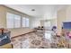 Spacious living area featuring tile flooring, large windows, and ample room for seating and decor at 5907 Zawawi Ct, Las Vegas, NV 89110