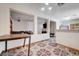 This living room has unique flooring and a passthrough to the kitchen and dining room at 5907 Zawawi Ct, Las Vegas, NV 89110