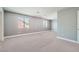 Generously sized bedroom with neutral carpet and two windows providing natural light at 5921 Royal Castle Ln, Las Vegas, NV 89130