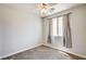 Bedroom features neutral walls, carpet, a window, and a ceiling fan at 6808 Mystic Plain Ct, Las Vegas, NV 89149