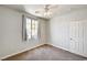 The bedroom is bright with neutral walls, carpet, and a window bringing in natural light at 6808 Mystic Plain Ct, Las Vegas, NV 89149