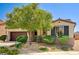 Attractive single-story home featuring a well-manicured front yard with landscaping and a two-car garage at 6808 Mystic Plain Ct, Las Vegas, NV 89149