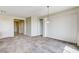 Open living space with carpet, chandelier, and access to other rooms at 6808 Mystic Plain Ct, Las Vegas, NV 89149