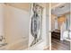 Bathroom with a shower, bathtub and access to the upstairs hallway at 7813 Falconwing Ave, Las Vegas, NV 89131