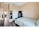Comfortable bedroom with a bed, closet, and view into the hallway at 7813 Falconwing Ave, Las Vegas, NV 89131
