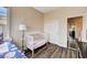 Bedroom featuring wood floors, two beds, and a closet at 7813 Falconwing Ave, Las Vegas, NV 89131