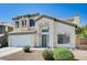 Attractive two-story home featuring a two-car garage and manicured landscaping at 7813 Falconwing Ave, Las Vegas, NV 89131
