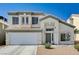 Charming two-story home with a well-maintained lawn and a two-car garage at 7813 Falconwing Ave, Las Vegas, NV 89131