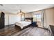 Main bedroom with closet, fan, windows, and dresser at 7813 Falconwing Ave, Las Vegas, NV 89131