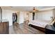 Sunlit main bedroom features a fan, closet, and natural light at 7813 Falconwing Ave, Las Vegas, NV 89131