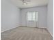 Cozy bedroom with soft carpeting, a ceiling fan, and a window dressed with sheer, patterned curtains at 855 N Stephanie St # 2415, Henderson, NV 89014