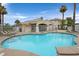 Sparkling community pool surrounded by lounge chairs and lush landscaping, perfect for relaxation at 855 N Stephanie St # 2415, Henderson, NV 89014