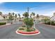 A gated entrance to the community, ensuring privacy and security for residents, lushly landscaped at 855 N Stephanie St # 2415, Henderson, NV 89014