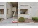 Exterior view of the condo complex featuring well-maintained grounds, signage, and convenient access to units at 855 N Stephanie St # 2415, Henderson, NV 89014