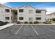 Condo building with assigned parking and manicured landscaping features a bright and pleasing exterior at 855 N Stephanie St # 2415, Henderson, NV 89014